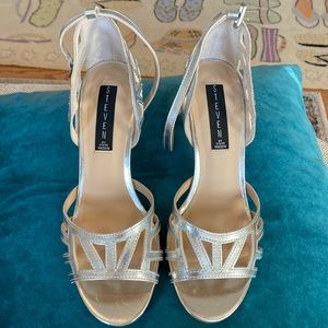 Worn once  Ankle strap bright silver sandals